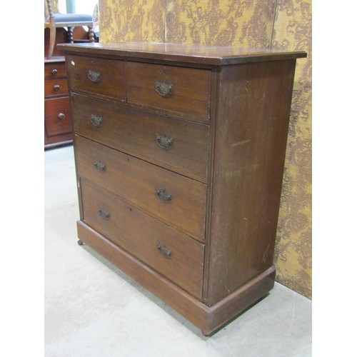 1134 - An Edwardian walnut bedroom chest of two short over three long graduated drawers set on a moulded pl... 