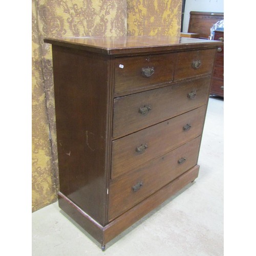 1134 - An Edwardian walnut bedroom chest of two short over three long graduated drawers set on a moulded pl... 