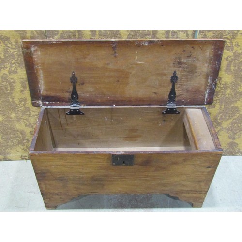 1135 - A simple antique elm countrymade boarded coffer with hinged lid, steel lock plate and bracket shaped... 