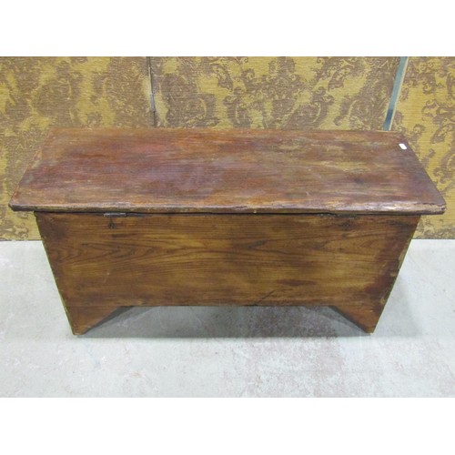 1135 - A simple antique elm countrymade boarded coffer with hinged lid, steel lock plate and bracket shaped... 