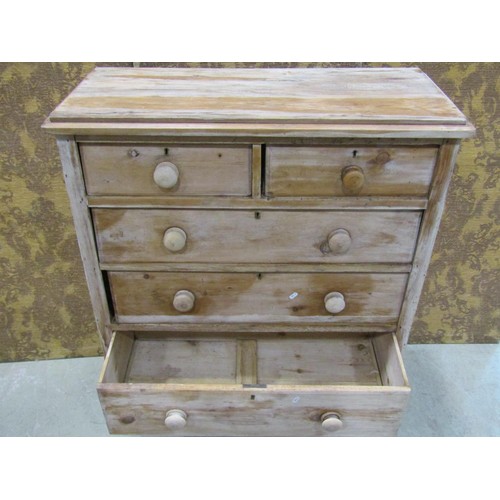 1136 - A Victorian stripped Pine bedroom chest of two short over three long graduated drawers with shaped a... 