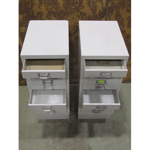 1137 - Two contemporary painted light steel floor standing filing cabinets each fitted with a tower of ten ... 