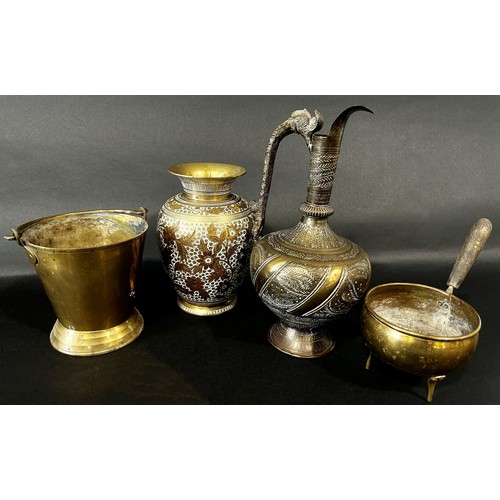 547 - A small collection of Middle Eastern brass ware, including a vase, a ewer, a small pail, a three leg... 