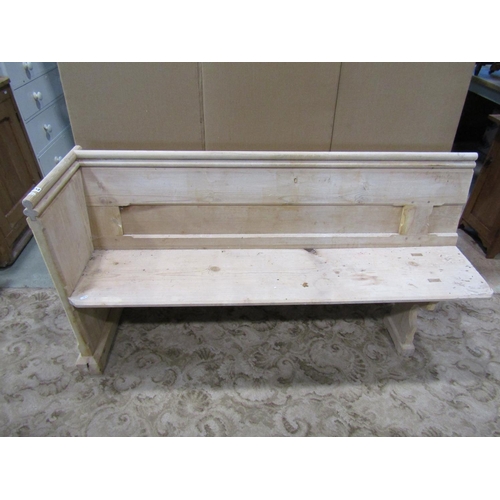 1120 - A stripped pine church pew, with moulded and chamfered frame and single shaped end, 62cm long (later... 