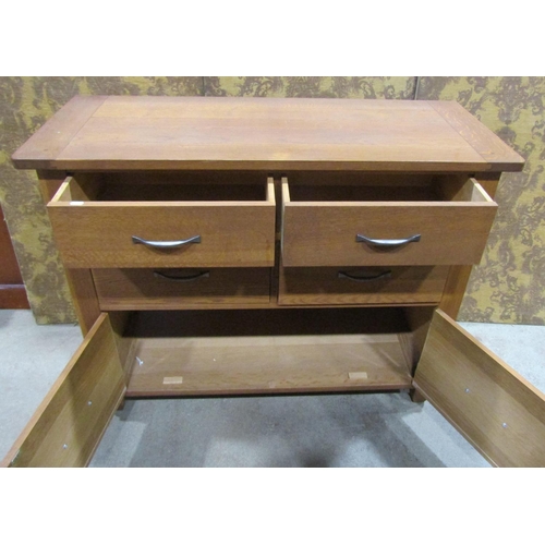 1123 - Contemporary oak chest of drawers, fitted with four drawers and two lower cupboards, with pegged fra... 