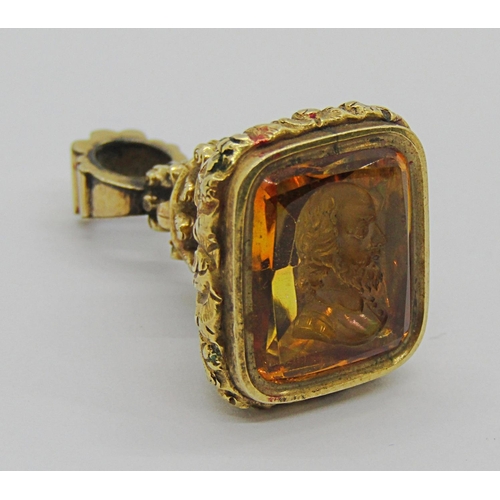 356 - 19th century yellow metal intaglio-cut citrine seal fob, probably depicting Shakespeare, 2.5cm H app... 