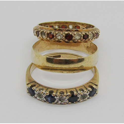 378 - Three vintage 9ct rings; a wedding ring with engraved detail and two gem set dress rings, 7.6g total... 