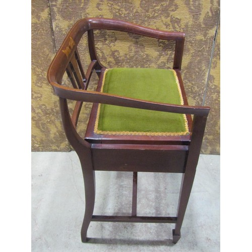 1215 - An inlaid Edwardian mahogany piano stool with hinged upholstered box seat beneath a shaped and mould... 