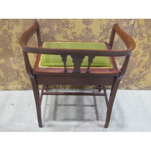 1215 - An inlaid Edwardian mahogany piano stool with hinged upholstered box seat beneath a shaped and mould... 