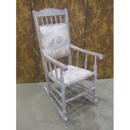 1113 - Edwardian rocking chair with carved cresting rail, later upholstered pad seat and back raised on tur... 