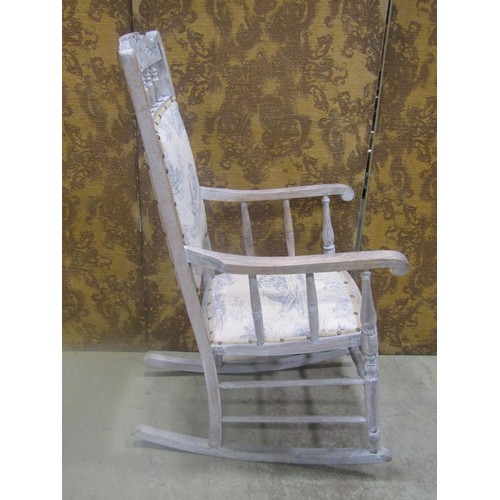 1113 - Edwardian rocking chair with carved cresting rail, later upholstered pad seat and back raised on tur... 