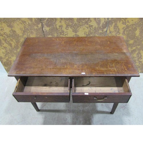 1216 - A Georgian oak side table, the rectangular top with moulded outline over two frieze drawers raised o... 