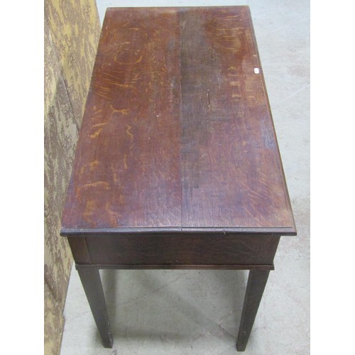 1216 - A Georgian oak side table, the rectangular top with moulded outline over two frieze drawers raised o... 