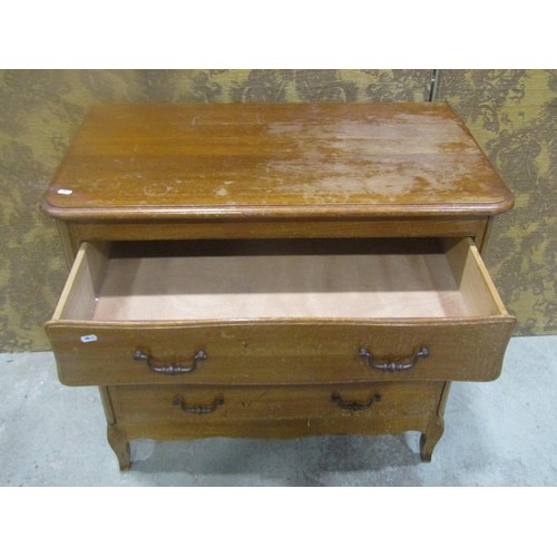 1147 - A continental oak commode of  three long drawers with shaped apron and swept forelegs, 82 cm high x ... 