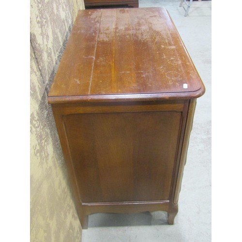 1147 - A continental oak commode of  three long drawers with shaped apron and swept forelegs, 82 cm high x ... 