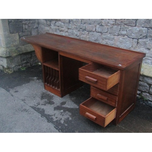 1143 - A teak kneehole twin pedestal desk partially fitted with four drawers and open segmented shelves (on... 