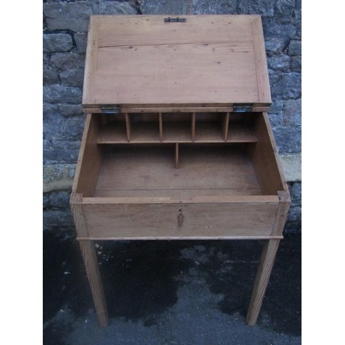 1152 - A stripped pine clerks desk, the hinged sloping lid enclosing a simple pigeon holed interior raised ... 