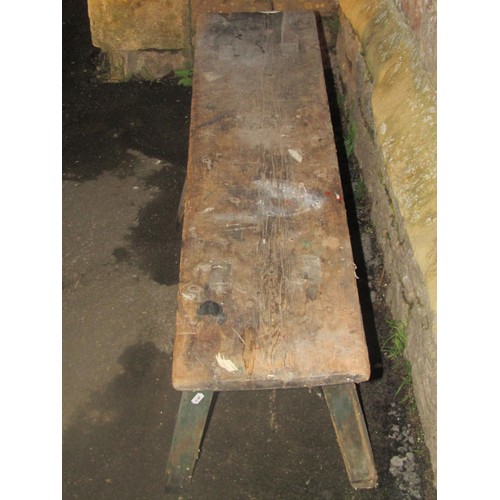 1164 - An old rustic pine  pig type bench with through jointed splayed supports (af), 47 cm high x 123 cm l... 