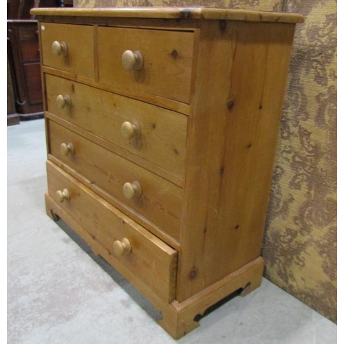 1227 - A stripped pine bedroom chest of two short over three long drawers on bracket supports, 93 cm high x... 