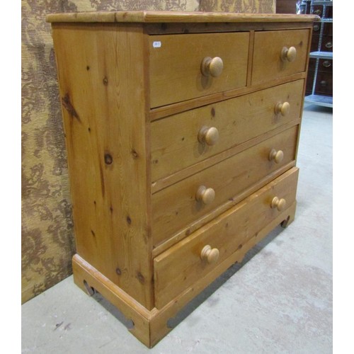 1227 - A stripped pine bedroom chest of two short over three long drawers on bracket supports, 93 cm high x... 