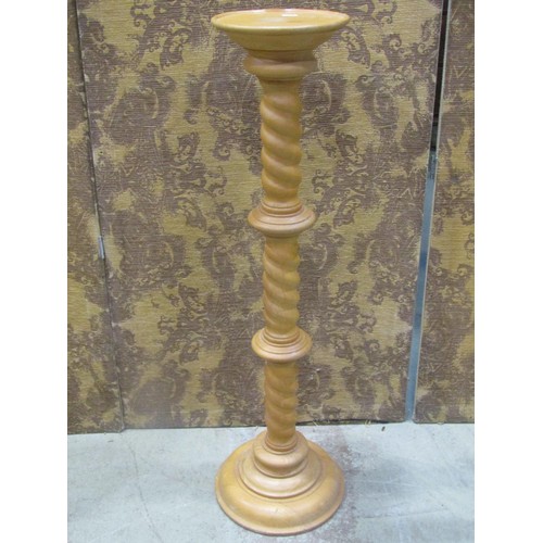 1232 - A contemporary beechwood torchere with spiral twist column 99 cm high together with a pair of furthe... 