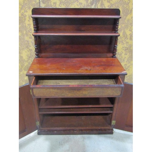 1261 - A 19th century mahogany chiffonier enclosed by a pair of arched panelled doors beneath a frieze draw... 