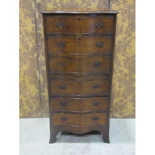 1265 - A figured walnut veneered serpentine front chest in the Georgian style of six long oak lined drawers... 