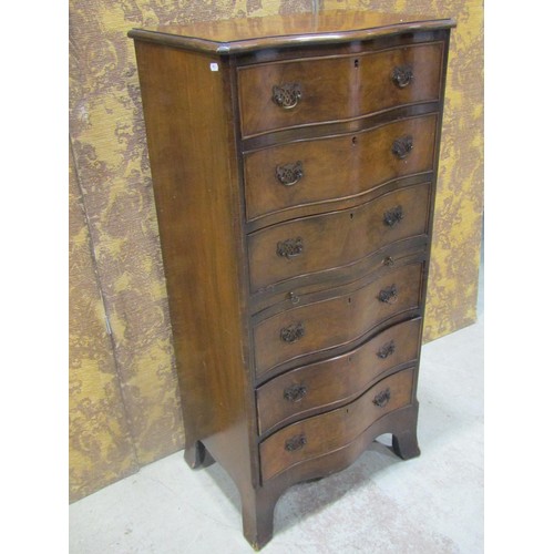 1265 - A figured walnut veneered serpentine front chest in the Georgian style of six long oak lined drawers... 