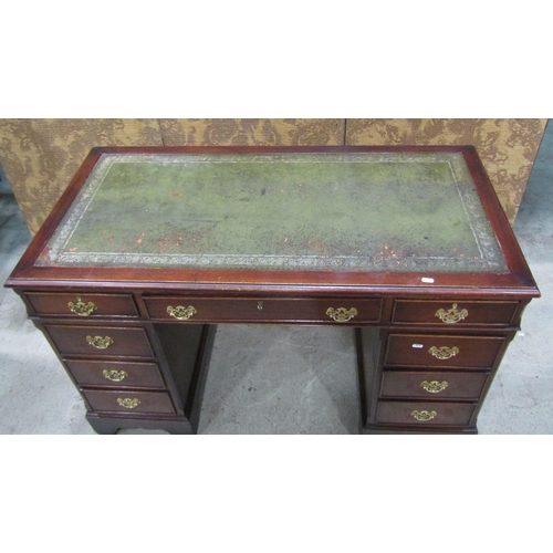 1218 - A reproduction Georgian style pedestal writing desk, 125 x 61cm, 79cm high, with associated oak chai... 