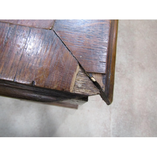 1221 - An oak pedestal desk fitted with six drawers and a cupboard with inset top, 125cm wide