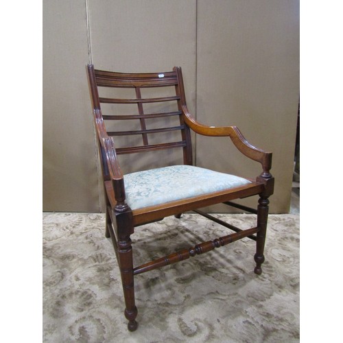 1270 - A late Victorian open elbow chair with upholstered pad seat, moulded frame and turned supports