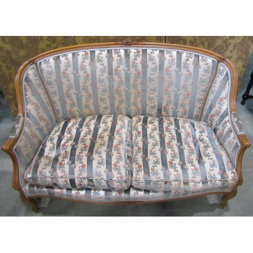 1274 - A French two seater sofa with carved and moulded frame, raised on cabriole supports with floral upho... 