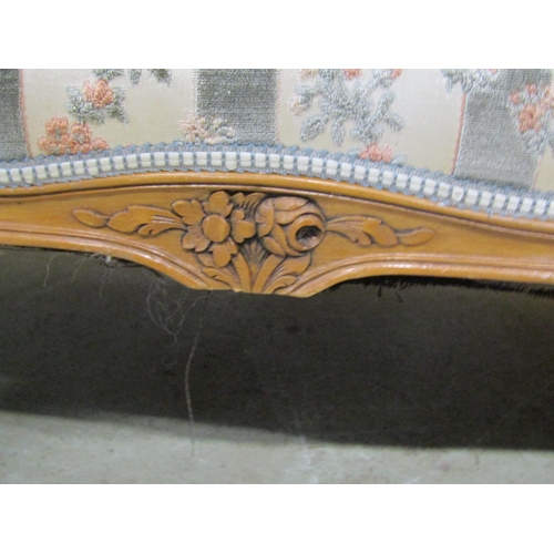 1274 - A French two seater sofa with carved and moulded frame, raised on cabriole supports with floral upho... 