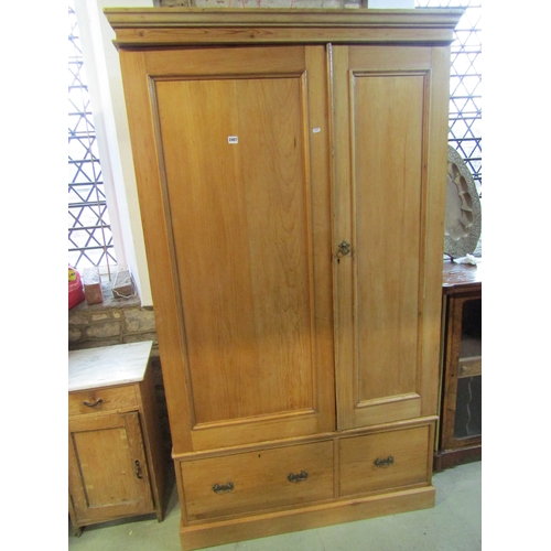 1282 - Victorian stripped and waxed pine wardrobe with two panelled doors, over two frieze drawers, 2m high... 