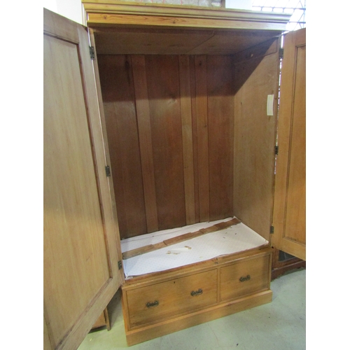 1282 - Victorian stripped and waxed pine wardrobe with two panelled doors, over two frieze drawers, 2m high... 