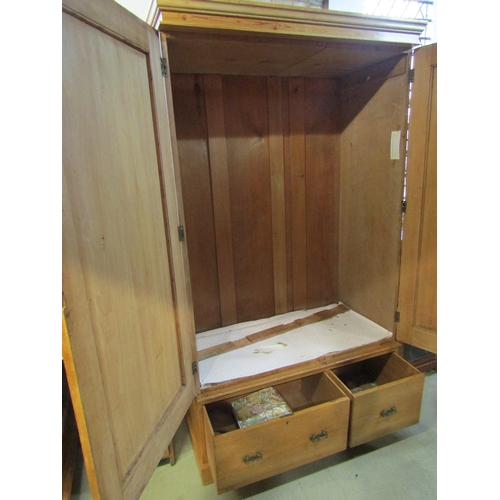 1282 - Victorian stripped and waxed pine wardrobe with two panelled doors, over two frieze drawers, 2m high... 