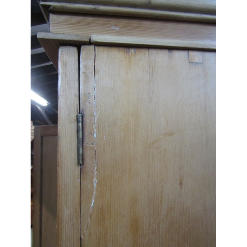 1282 - Victorian stripped and waxed pine wardrobe with two panelled doors, over two frieze drawers, 2m high... 