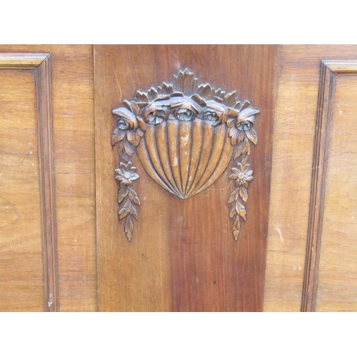 1295 - Early 20th century mahogany double bed frame in carved wood with floral decoration, to accept a 4'6