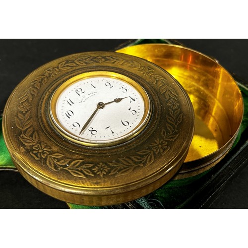 517 - Early 20th century travelling clock in engraved circular case and Morocco leather case, with enamell... 