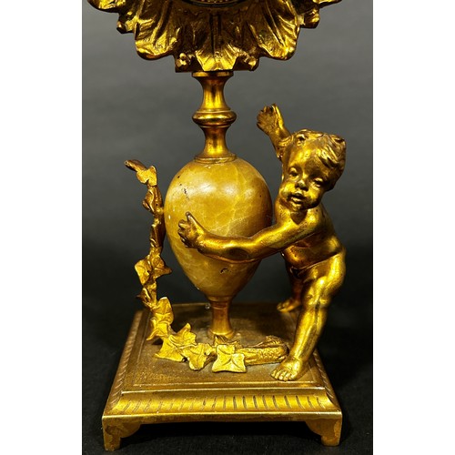 518 - 19th century gilt mantle clock the painted dial within a flower head border, surmounted on an onyx s... 