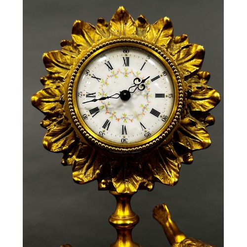 518 - 19th century gilt mantle clock the painted dial within a flower head border, surmounted on an onyx s... 