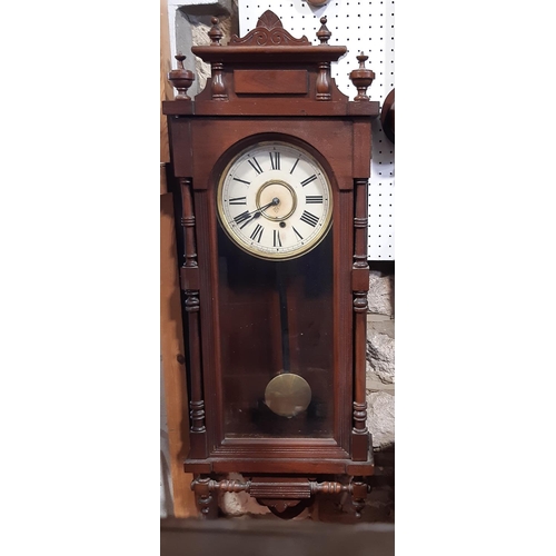 521 - Late 19th century Ansonia wall clock with column supports and eight day time piece