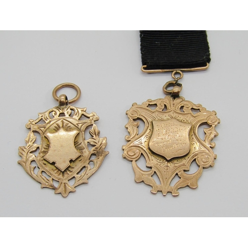 311 - Edwardian 9ct mounted ribbon fob with medal inscribed 'Edwin Bibby for General Excellence', 14.5g gr... 