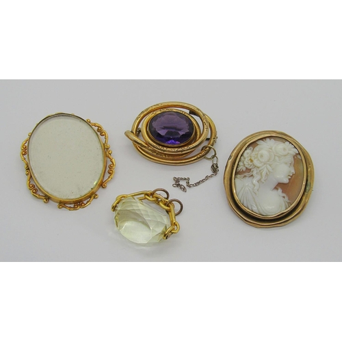 318 - Group of antique yellow metal jewellery comprising a 9ct brooch with scrolled frame, a citrine swive... 