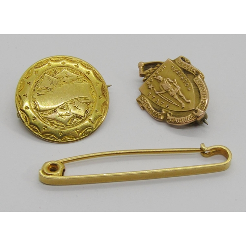 319 - Group of antique yellow metal jewellery comprising an 18ct tie pin, 1.7g, a circular brooch with eng... 