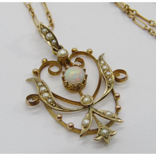 323 - Art Nouveau 9ct cabochon opal and seed pearl pendant hung from a period 9ct chain necklace with barr... 