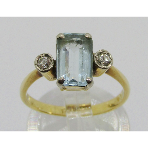 325 - Early 20th century 18ct emerald-cut aquamarine and diamond three stone ring, size J, 3.4g