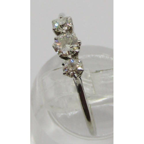 327 - Early 20th century three stone diamond ring in white metal, mark worn - either platinum or 18ct whit... 