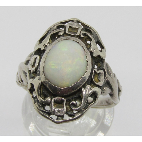 333 - Arts & Crafts style silver openwork dress ring set with a cabochon opal, size P and a Bohemian garne... 