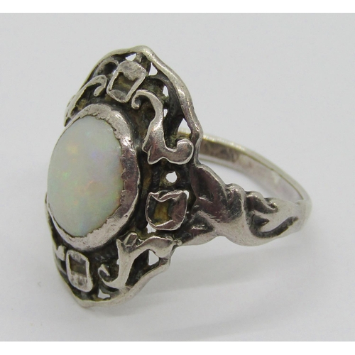 333 - Arts & Crafts style silver openwork dress ring set with a cabochon opal, size P and a Bohemian garne... 